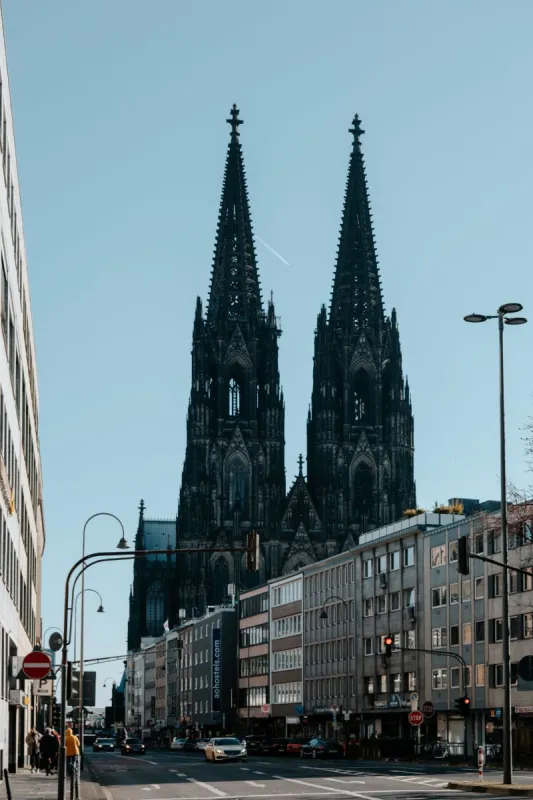 The twin spires of Cologne Cathedral above the street
