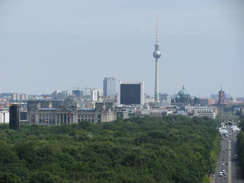 Berlin skyline with the Reichstag, the TV Tower and the Tiergarten park in the foreground.