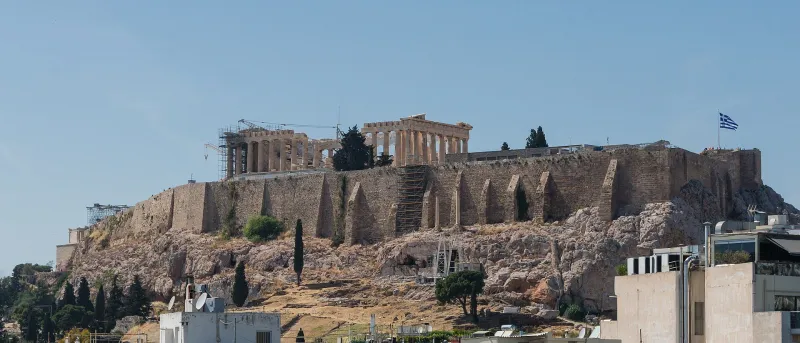 The Parthenon on the Acropolis rock above the rooftops of Athens.