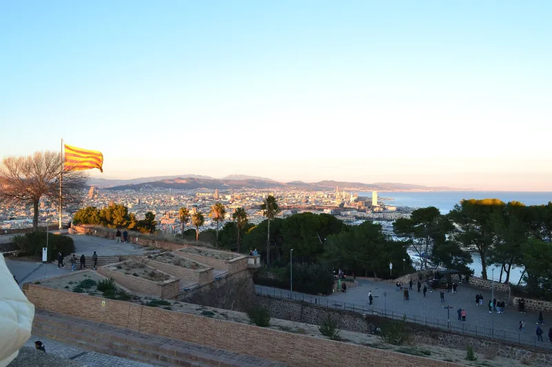 Barcelona and the Mediterranean seen from Montjuic Castle at golden hour.