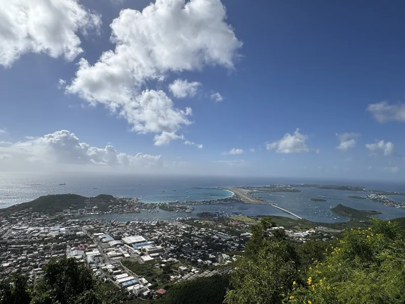 View from the hills over the western end of Saint Martin with the lagoon and coastline.